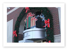 Building Front Displays, Custom Arched Garland with Bows and Lighted Christmas Present Display